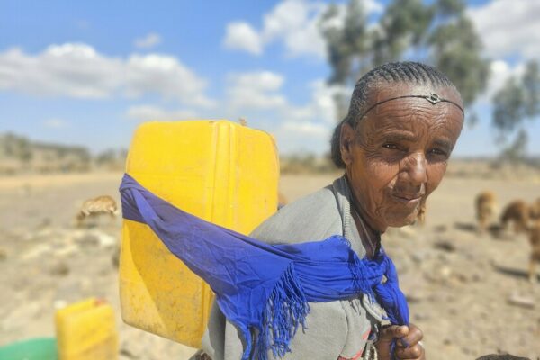 It is predominately women and children who are tasked with fetching the water, but for 70 years old Letensea there is no one else who could take on her task. She lives alone with her four-year-old grandson Danay after her only son died in 2022 in the conflict in Tigray. We lost our biggest supporter when he died. I am lonely and my grandson always asks me where his father is, says Letensea.

Letensea and her grandson live in a small community in wide open fields and on dry land and she is a member of the communitys water committee. Before the conflict, the community had installed a water pump that ran on a fuel-powered generator. The generator was often broken, and it was not powerful enough to access the amount of water that the community needs, says Gebregergis, 75, a fellow member of the water committee. When the conflict started, they could no longer afford to run the water pump. The price of fuel was 10 US-Dollars per liter during the conflict. Before it was only 1 USD. And then there was a shortage of fuel. So, during the conflict, we had to power down the water pump completely and we had to walk again, Gebregergis continues. Using water from rivers or lakes has a high risk of spreading disease, as these water sources can easily be contaminated by open-air defecation, increasing the risk of cholera outbreaks. With the support of our local partner REST, CARE has now installed solar panels to power the water pump in the SELAM project. The communitys school and clinic have also been connected to the water system, giving them access to running water. Now there is no cost. No transportation, no fuel, because we can run it by ourselves and it is so powerful, says Gebregergis.
2,000 people have had access to the four taps distributed around the community for four months now. The burden for women and children has been reduced tremendously, Gebregergis adds. Letensea no longer walks to the river, as the water allocated close to her home meets all her needs. I had prayed to God every day to bring us clean water. Now it is here. Now its easy for me. It saves time and energy. And I even have enough for my sheep to drink, she says. The sheep are Letenseas main source of income as she does not have any land to live from and they mean everything to her. I went to the river myself, to fetch water and bring it to the sheep. I do not take my sheep down that dangerous path. I am too scared to lose one, she says.

The land in Tigray is dry and the current drought is putting an even heavier strain on the community. Even with the solar-powered water pump, there is not enough for everyone. We have to limit the water access. Four jerricans per person, which is 80 liters, and only between their assigned time frames. We in this group can fetch our four jerricans between 2 and 6 p.m. With this we can use the limited resources more effectively, says Gebregergis. They decide together as a committee to face the challenges of drought, the impact of the conflict, and economic instability. This year the drought is severe. Before the solar panels, there were many days, I went without one drop of water because getting to the river is so difficult for me. We are trying to survive as well as possible, but we need help. I am so grateful, that my grandson, my sheep, and I at least have enough water now, concludes Letensea.