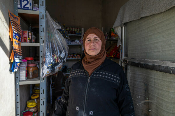 “My little shop is vital for survival” 

When Ezra* thinks about the earthquake that struck northwest Syria a year ago, she recalls only tears and pain. “My tears streamed down my cheeks, mixing with the heavy raindrops that fell simultaneously,” she says. Standing before her devastated small grocery store, Ezra felt she was facing “the ruins of her existence” as she described it. How would her family survive now? The refrigerator laid in ruins, and all the supplies and products on her shelves were strewn about and unusable. Not a single item in her shop could be salvaged. 

Ezra, 46 years old, is the mother of five children, residing in a small town in northwest Syria. Since her husband disappeared at the onset of the Syrian conflict, she has been solely responsible for providing for the family. The grocery store she established twelve years ago was her sole possession. Until the earthquake struck, it had sustained her and her children. Ezra’s kiosk was also vital to the neighborhood, providing essential items within easy reach. 

Following the earthquake, she lacked the funds to replace the lost and damaged items in her shop. She could only focus on clearing away the debris, repairing, and cleaning the sales area. She held onto hope that one day she could restock her kiosk, but she was uncertain when or if that would be possible. 

The organization Shafak, a partner of CARE in the region, made Ezra’s dream a reality through an aid project focused on livelihoods. Owners of shops destroyed by the earthquake receive financial aid to reopen their businesses. The aim is to restore the operators’ livelihoods through renewed income. Equally vital is the economic support and access to services provided by small grocery stores in the region. This initiative helps partially restore the damage of affected communities ravaged by the earthquake. With financial backing from the European Union, CARE swiftly provides emergency aid while fostering long-term prospects for displaced individuals in Syria. 

“I desperately needed the grant,” says Ezra. “My only hope for a decent life hinged on rebuilding my shop.” As part of the project, she also participated in training courses. Following the initial payout, Ezra purchased a new refrigerator and essential groceries such as lentils, rice, bulgur, and sugar. She had already repaired the broken shelves in her store. 

Today Ezra is overjoyed that with the reopening of her business, her children can continue their education. “I can return to work and provide them with a life of dignity,” she says. Unfortunately, Ezra remains haunted by the fear of another earthquake as she says the disaster has impacted her mental health but nevertheless, she has ambitious plans. Ezra hopes to expand her food sales and establish a women’s workshop were, widowed women or those supporting their families alone for other reasons can earn income by producing household goods. 

*Name changed to protect identity 