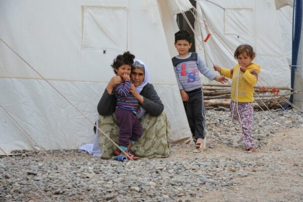 Hanee with several of her grandchildren. "What are we doing with this life? We have had to flee our homes and live in this camp, in these tents! What kind of home is it? Underneath us are only hard stones. Water leaks beneath the tents, making such a bad smell. We miss our home."Berseve 1 is one of the largest camps for displaced persons in northern Iraq, with almost 15,000 people living there. CARE is supporting garbage collection, waste removal, and latrine cleaning through teams of Iraqi staff and volunteers and in collaboration with local partner agency, Harikar. CARE has also supplied garbage bins, kerosene stoves, barrels and fire extinguishers. Photo credit: CARE International/Mary Kate MacIsaac