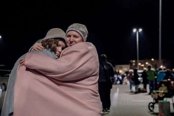  Kotove Snizhenne, 45-years-old and her daughter Kotevyne, 12, stand outside a transit center in Przemysl, Poland, on March 2, 2022.
The situation was tensed, with the bombs and fighting when they left. The grand-mother is stranded in her town, surrounded by Russian forces.
Kotove says : "My daughter say everything,and she saw the images of Russian tanks in her grand mother's town. She can't stop crying and is frightened all the time." The children used to study in Lviv and the mother says she now worries for their education, as "Everything is under depression in Ukraine now. If the war continues there will benothing left. Everything is linked with the war now. It is a bloody, monstruous war."