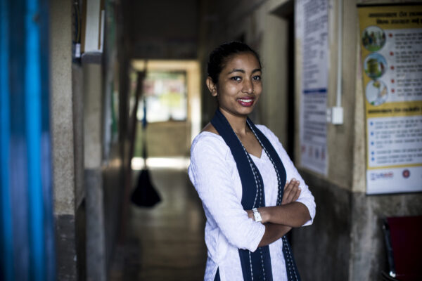 Life2Live: Every woman deserves to give birth safely

Caption - Portrait of midwife Arti Sah in the maternity clinic in the village of Ambote, Nepal

Midwife Art Sah works in Aambote health facility. Arti was part of the same batch of midwifes as Pramila- trained by CARE, funded by GSK. “I felt very lucky to be part of CARE’s SBA (skilled birth attendant) training. It’s a very big thing to get the training. It gave me in-depth insight and practical skills, and it has given me confidence.

I’ve delivered 20 babies since I began working here in March. I feel very lucky, very happy and thankful.

Arti recently saved the life of a local woman, Sabita, who was stretchered to the facility with her baby, with a retained placenta. She was shocked at the sight of Sabita’s baby, which was placed between her legs, still attached to Sabita, and covered in mud.

Arti knows she saved Sabita’s life. “I feel very proud. I feel very happy when I get a successful case – there is nothing bigger than that. Than the happiness I feel when a healthy mother leaves the facility with a healthy baby.”

It’s not all happy for Arti, though. While she loves her job, the health facility is desperately understaffed. Arti says she is only able to see her family once a year, for four days. Her family scold her for “being married only to her job.” But Arti knows how vital her role is in the community of Aambote, especially during monsoon season. If Arti isn’t there, and a pregnant woman needs urgent healthcare, she would need to be stretchered for 15km to the nearest market village, and then catch a public bus for 40km to the district hospital. The last bus leaves at 3pm, so if they miss the bus they would be stuck overnight. Since Arti arrived in Aambote, there have been no maternal or infant deaths.