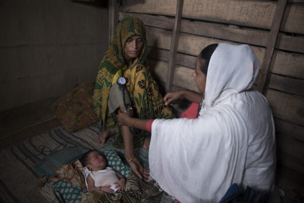 Selina Begum is a community skilled birth attendants (CSBA). She lives and serves in the community in Jalalpur in the district of Sunamganj which is in North-west Bangladesh. Besides providing door-to-door maternal services, she also runs a pharmacy for providing basic health care to her community. Amidst the recent COVID-19 outbreak, she told us the following:  

Yes I have heard about the virus. It is a disease that spreads very quickly. 

I use mask when I go outside and visit my patients.  

I am still providing door to door service for the community. I aware people about this disease when I visit them. I tell them about the symptoms and preventive measures. My shop is still open.

Pregnant mothers are getting very worried about the situation; I try to ease them and calm them and tell them not to worry. 

I try to keep my household clean. I have kept water and soap for hand washing. 

To continue our services, we need protective gears to be able to serve the community.

----

Saving lives through providing instrumental services 
Such devotion to work earned her a unique identity in the locality.

In August 2017, 22 years old housewife Habiba was suffering from delivery complications. She was lucky to have Selina by her side, who being a trained birth attendant—checked her partograph and reported that she would not have a normal delivery. Selina soon took Habiba to the Sunamganj General Hospital, and her delivery was successfully done at 3am. Recalling that night, Habiba’s husband says, “If Selina Apa hadn’t taken her to the hospital at the right time, my wife and baby would have died.” Lovely from Fatehpur village was equally grateful to her. When Selina took Lovely to the Maternal and Child Welfare Center (MCWC) at the district town, it was already 4am. She had to undergo a cesarean delivery due to complications. Such devotion to work earned her a unique identity in the locality. With her willpower and hard-work, she has secured a respectable place in society.


Selina was married to a sales representative in 2009, and they faced a lot of financial hardship as she gave birth to two children. Her husband’s income source was not a permanent one. She realized that she would have to earn besides her husband to make the family a well-running one. But nothing attracted her attention like the Private Community Skilled Birth Attendant (Private CSBA) program, conducted by CARE GSK Community Health Workers Initiative. The goal of this project was to reduce death rates of pregnant women and newborn babies in the remotest locations, while also encouraging women to be self-sufficient by being a sustainable health entrepreneur.

Selina started her training quite late in 2016. As she began providing maternal and child health services as a Private CSBA, she turned out to be a problem for the local traditional birth attendants. They did not want her to work in their area fearing that, in the presence of a skilled birth attendant, their acceptability and income would be reduced. Many clients thought of her as a government birth attendant, so they refused to pay. She was worried, whether she will be able to continue her work in such situation. 

Soon she chalked out a new plan and stayed with patients for the whole night and accompanied the complicated cases up to higher facilities at district level as part of referral, a strategy that no government health worker would follow. By then she was on good terms with Sunamganj Sadar Hospital staffs and health volunteers as she referred patients regularly to this hospital. Her efforts changed perceptions about her services in the locality.

The service recipients started showing gratefulness for her dedication as a skilled health service provider. Besides she has established a good linkage with the community health system, therefore she is conducting deliveries at community clinics and family welfare centers at union level.

Now she works as an adviser to local people on pregnancy related issues. She is also a community sales agent of SMC’s (Social Marketing Company) healthcare products at a competitive price. Of all the people who helped her on this
journey, she is most grateful to her husband. Her husband advertises her services out of his marketing experiences, takes care of the children when she is at work, buys medicines for her business from a local bazaar and at night he accompanies her to her client’s house. Happy with her husband’s cooperation, Selina has bought him a mobile phone. Their married life had never been more functional with mutual respect, now suffusing their home. 

----

About project: 

Since 2012, CARE Bangladesh has been implementing an innovative public private partnership to address the shortage of health human resource issues in a remote areas with funding from GSK’s 20% profit reinvestment policy. To address the above issue, the project has developed 300 Skilled Health Entrepreneurs (SHE) in Sunamganj and 110 SHE in Netrokona district supported by communities, public health system, and Local Government bodies. The private providers are accredited by Bangladesh Nursing Council with six months’ community skilled birth attendant training complemented by community based integrated management of childhood illness (C-IMCI), FP, nutrition and social entrepreneurship training. Each provider has a market size of about 7500 population and is supported by 10 community health workers (CHWs).

 