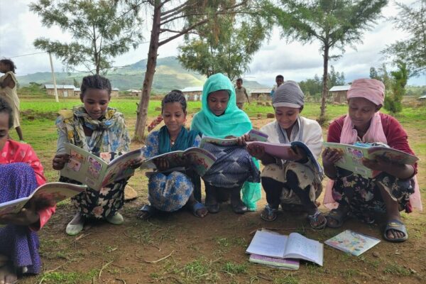 CARE initiated girls’ groups in communities that teach girls through different discussion sessions about life skills. The girls come together and sit on small stones in a big circle. They come together and study their workbooks and discuss about social norms in ther community. They gain self-confidence and learn how to negotiate and to stand up for themselves. Eyerus, a member of a girls group aged 10 to 14 negotiated with her father until he agreed to cancel a proposal that he already agreed to. Tadella, 14, a member of the group, was very shy before she joined this group, now she learnt how to speak up.