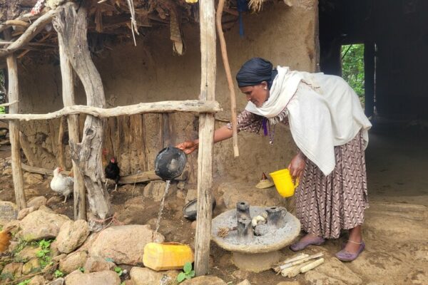 Fana*, previously she was a FGM practitioner. Now she is a member of a CARE SAA group. She is cooking in front of her house in a village in Ethiopia.

Every second girl in Ethiopia is being cut. In the 1970s, even nine in ten girls have gone through this process. “We are changing as a community. As a group, we came together to discuss the social norm and tradition of cutting, and we reject it now. But in the community, there is sometimes still a positive attitude towards it. We try to fight this,” says Terfa, a member of a Social Analysis and Action (SAA) group implemented in communities by CARE. SAA is a facilitated process through which individuals explore and challenge the social norms, beliefs, and practices that shape their lives and health. 
Risks of female genital mutilation
“I started with the cutting of girls because I wanted to be loved by the community. As a practitioner, you are the main and important part of the ceremony. I gained a lot of social respect,” remembers Fana*, 38 and mother of four children. She was a traditional practitioner who learned the process by watching another practitioner. After she joined one of CARE’s SAA groups, she stopped her work immediately. “I regret cutting those babies because they were suffering. There was always a risk of them getting an infection or even dying because of what I did to them,” she continues. In the group discussions, she learned about the risk of fistulas, swelling, fever, infections such as tetanus, later problems with urination and menstruation, scar tissue, problems during intercourse, and the increased risk of childbirth complications such as difficult deliveries, bleeding, and the need to resuscitate the baby. 
“We now understand the health consequences and the long-term damage,” says Terfa. The SAA group members have a system in place, where every member has a network of about five families that they are responsible for in the community. They raise awareness about the consequences of female genital mutilation (FGM) and report to the group if a family wants to go forward with the ceremony. “I now work against this practice. If someone in my network has a baby girl, I will go to their home immediately. I try to raise awareness. Five days later I come back to check on the girl,” describes Fana. 
Checking on the girls
With this practice, the community of about 6,000 people has reached a 0% FGM rate. “Before we were at around 85%. In the last year, six women in the community gave birth to a girl. None of them were cut”, explains Terfa. Fana also notices a difference, “No one asks for my services anymore. No one has knocked on my door. I do the knocking now to check on the girls.” The practice is still common in Ethiopia being home to 25 million women and girls who have undergone FGM, the highest rate in Southern and Eastern Africa. FGM is primarily driven by gender norms and cultural practices that are held in place. “Most parents believe that the girls won’t be able to have sex physically if they are not cut. Others believe that she will not be beautiful and won’t be wanted. We made a lot of mistakes before,” concludes Terfa. 

*name changed for protection reasons