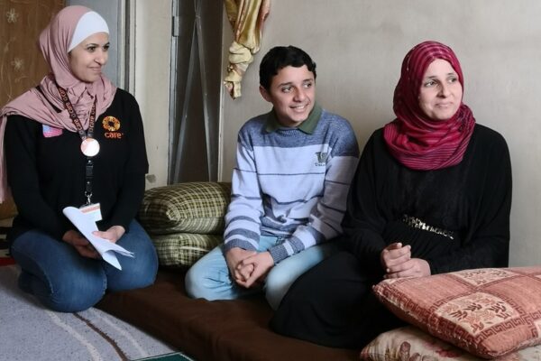  “I gave birth to my youngest son in a tent. It was so cold & wet. I couldn’t keep him warm. I had to go ask for help from aid organizations”, said Asmaa, a 35 year-old mother of four from Syria, to Caroline Kende-Robb, CARE’s Secretary General in their meeting in Amman. The family arrived in Jordan in 2013 and lived in a tent for four years, before moving to Amman: “It did not protect us from the cold winter nor the hot summers”. Asmaa’s husband Jehad Hussein, 46 years old, is suffering from diabetes, blood pressure & has had heart surgery, after a heart attack. Asmaa is now the head of the household but also suffers from broken blood platelets. 

After CARE’s assessment, a service plan was developed and with the cooperation of the family, they are now receiving assistance to cover their basic needs. When they first arrived, Asmaa’s son had to work long hours for 4.5 USD daily as the family was struggling to cover basic needs. Today with CARE’s Conditional Cash assistance, they are also receiving 70 JDs every month for Isameel who is back in school. 

“CARE has saved three of my children and put them back in school”. Isameel is now attending the 8th grade and Asmaa is visiting regularly the child protection department and CARE’s child education and board sessions. Asmaa was also referred internally for the psychosocial program with a peer support group. Supporting Syrian women like Asmaa is key for the future of Syrians.